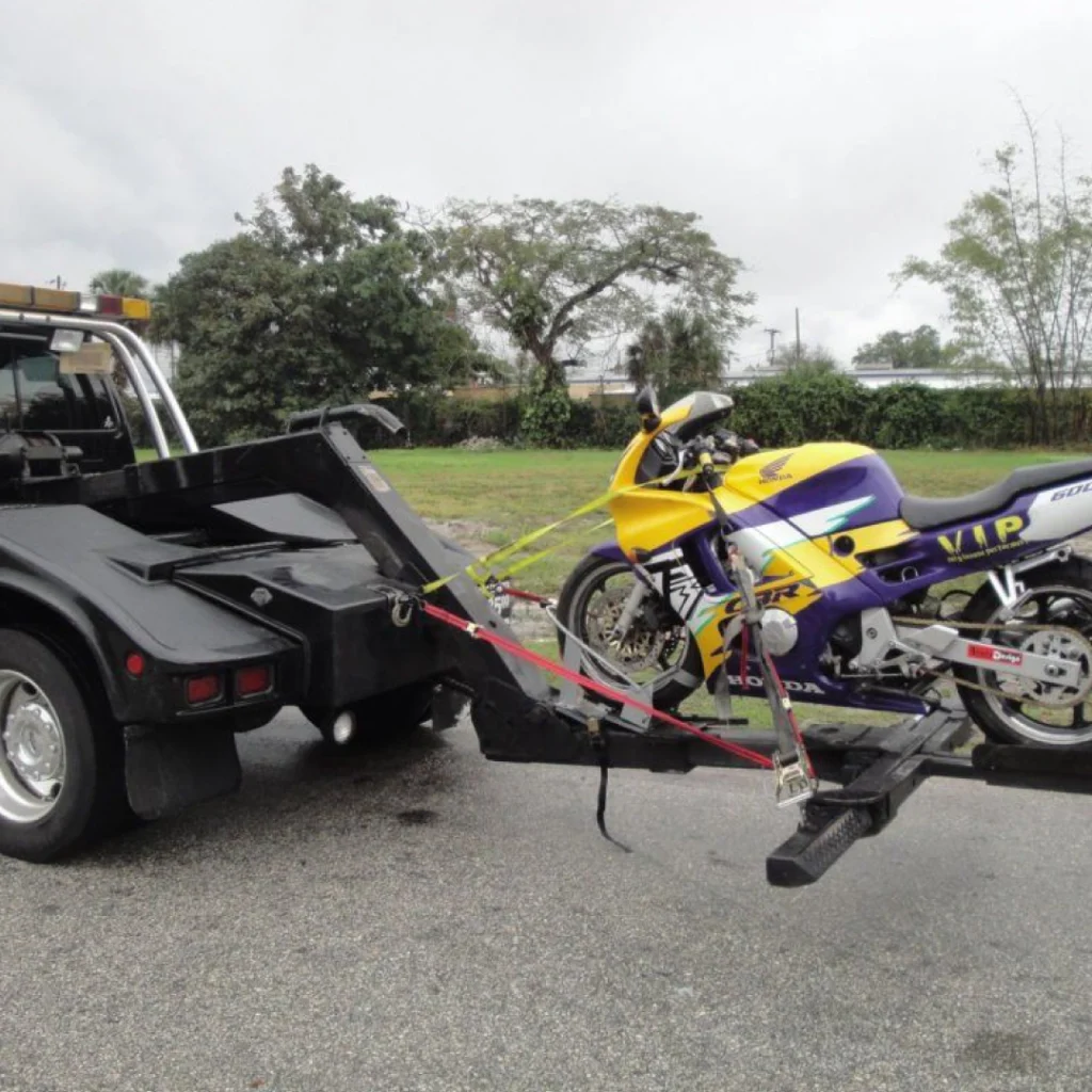 a motorcycle towing a tow truck