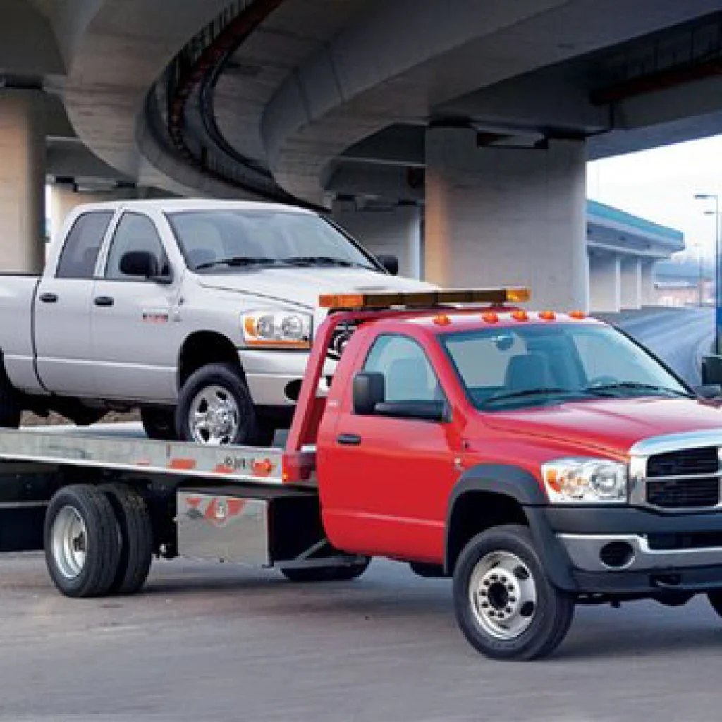 a tow truck carrying a car