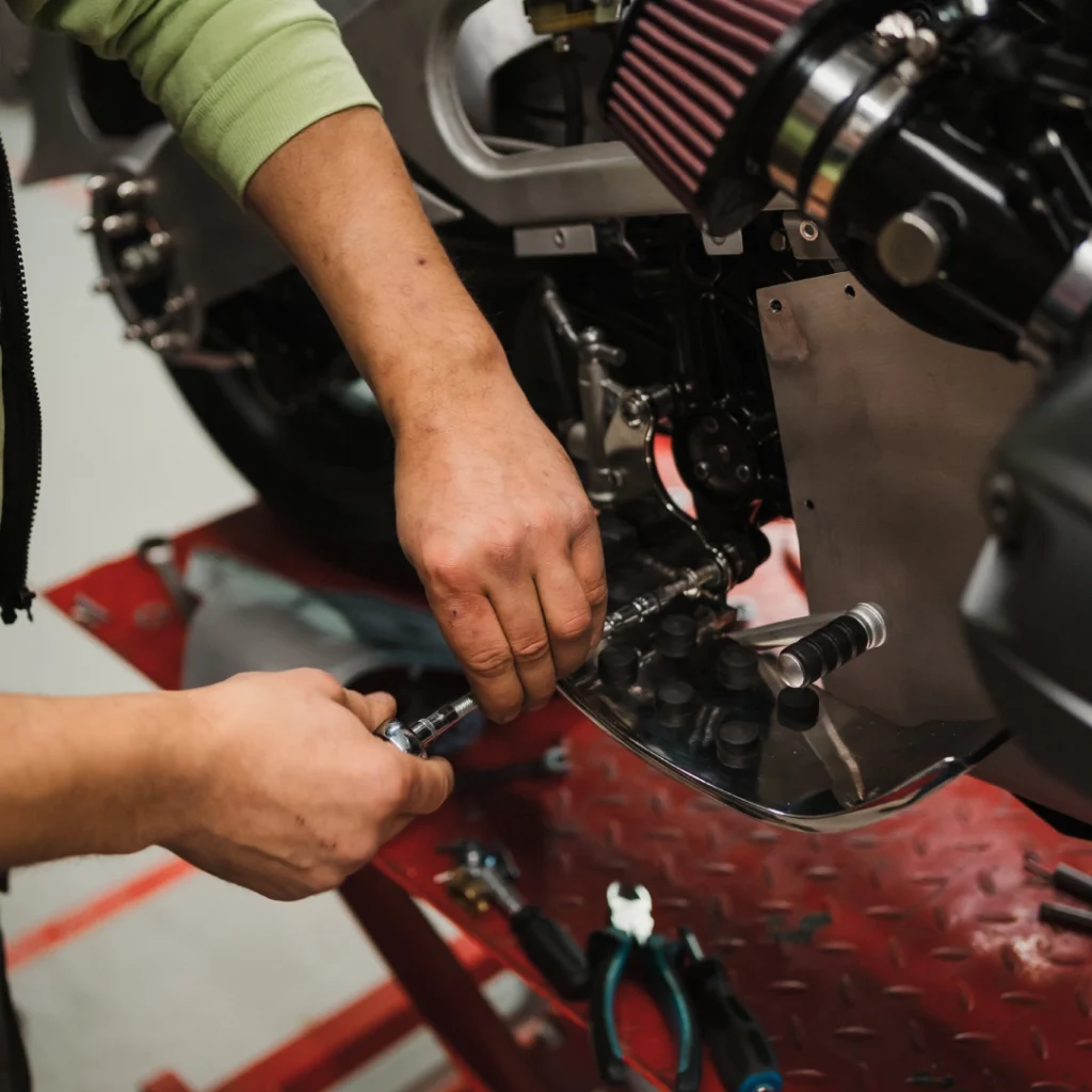 a person working on a motorcycle