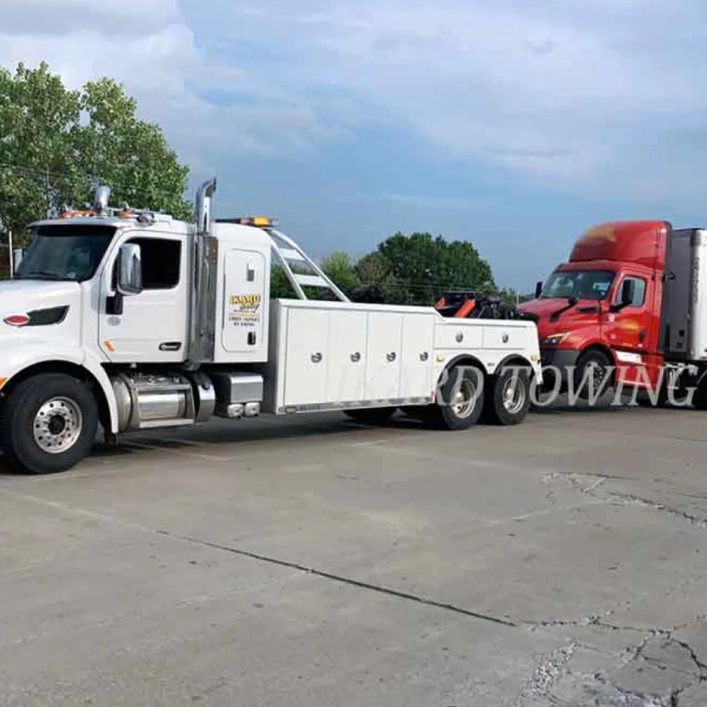 a tow truck with a tow truck on the side